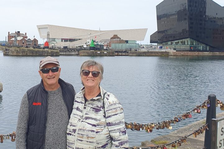 a man standing in front of a boat