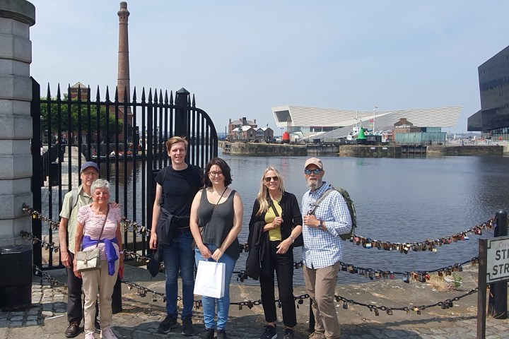 a group of people standing in front of a building