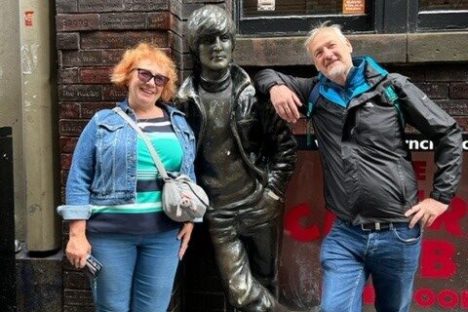 a group of people standing in front of a building
