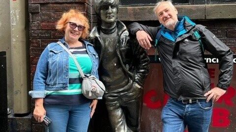 a group of people standing in front of a building