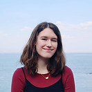 a person standing in front of a body of water