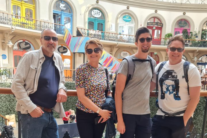 a group of people standing in front of a building