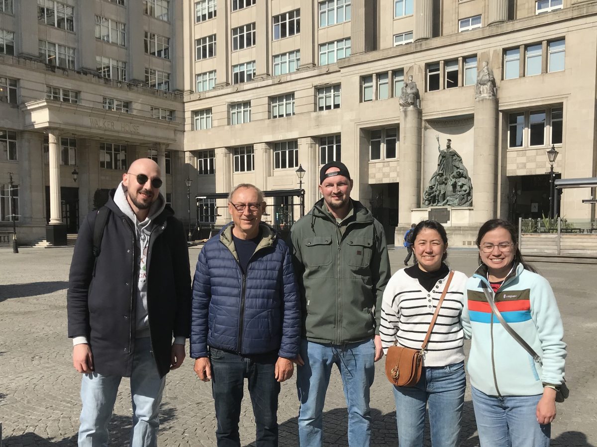 a group of people standing in front of a building