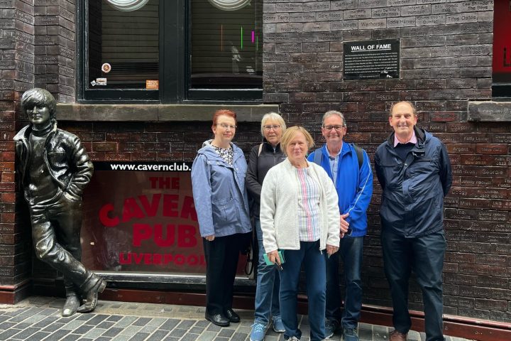 a group of people standing in front of a building