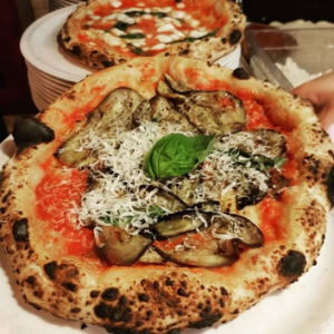 a close up of a plate of food with a slice of pizza