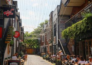 a group of people walking on a city street