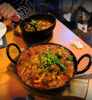 a pizza sitting on top of a pan on a table