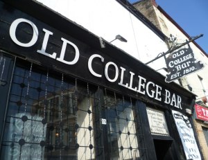 a close up of a street sign in front of a building