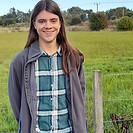 a person in a green field