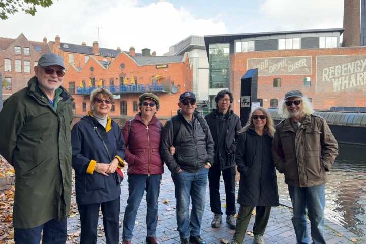a group of people standing in front of a building