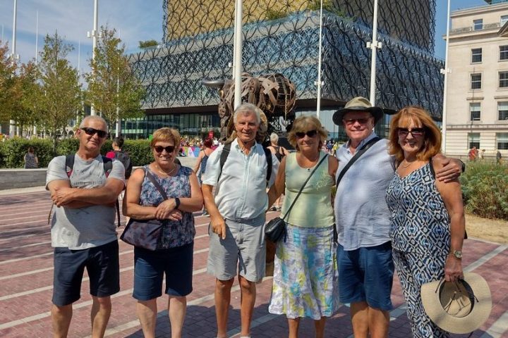 a group of people standing in front of a building