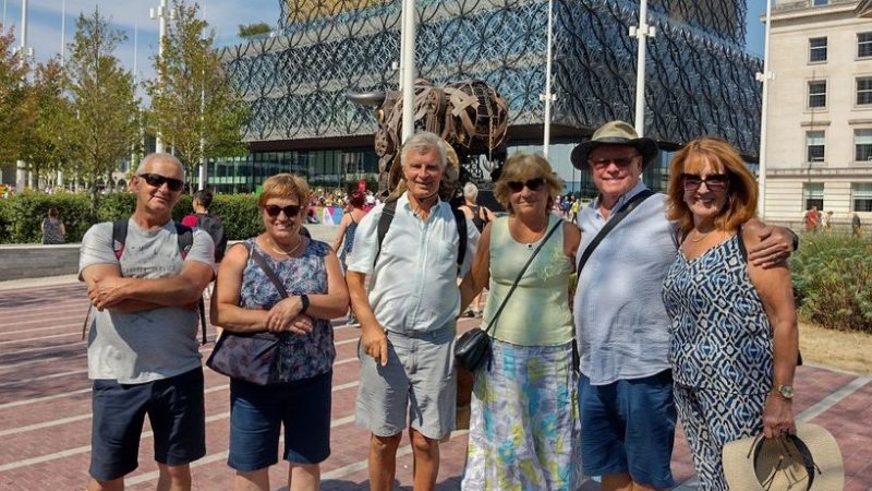 a group of people standing in front of a building