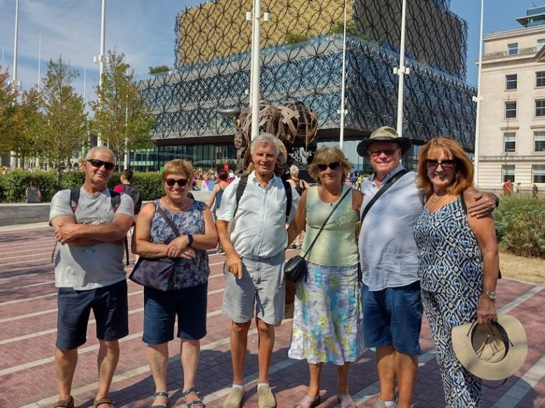 a group of people standing in front of a building