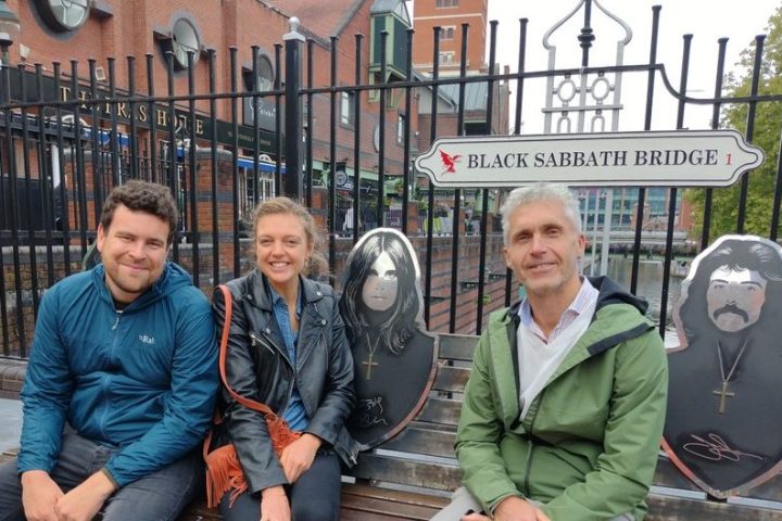 Yuri Orlov et al. that are sitting on a bench posing for the camera