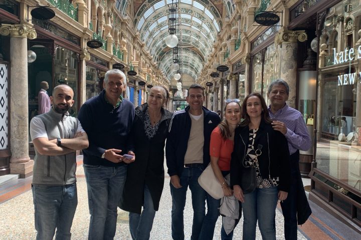 a group of people standing in front of a building