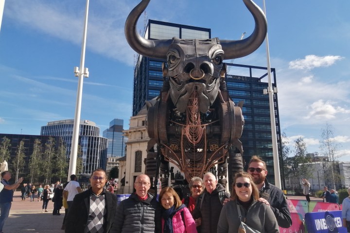 a group of people standing in front of a crowd posing for the camera