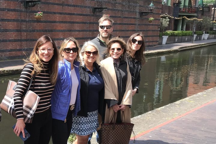a group of people walking down a street