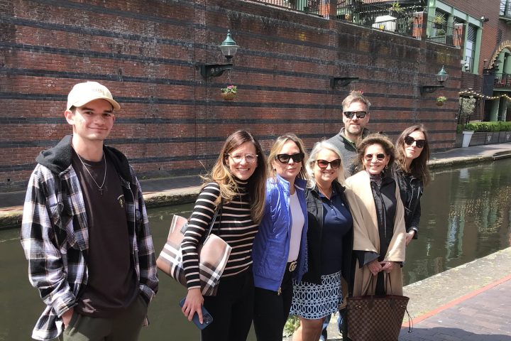a group of people walking down a street