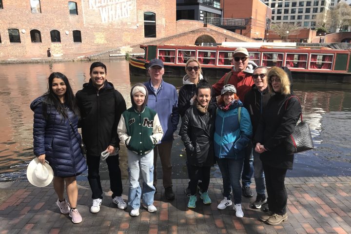a group of people standing in front of a building