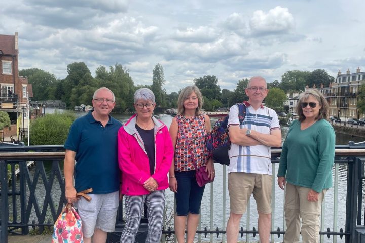 a group of people standing in front of a building