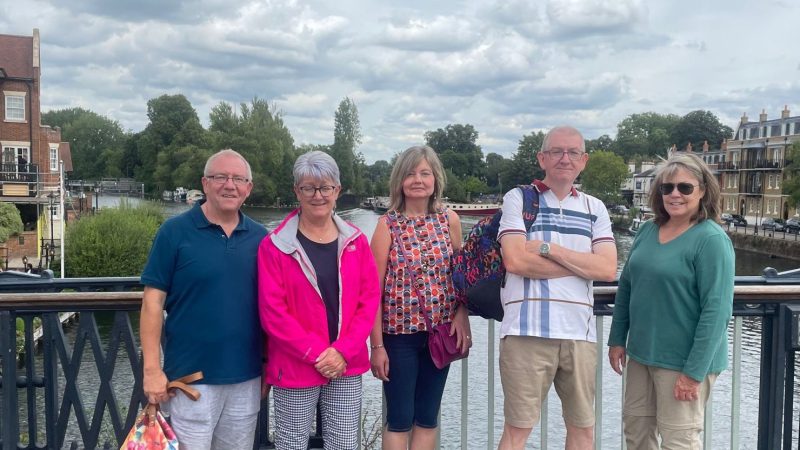 a group of people standing in front of a building