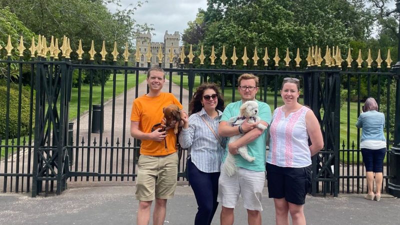 a group of people standing in front of a building