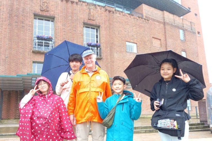 a group of people standing in front of a building