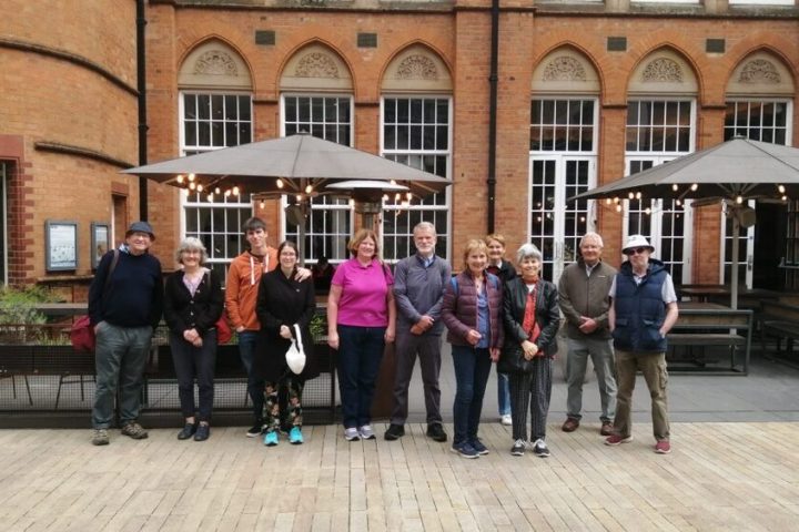 a group of people standing in front of a building