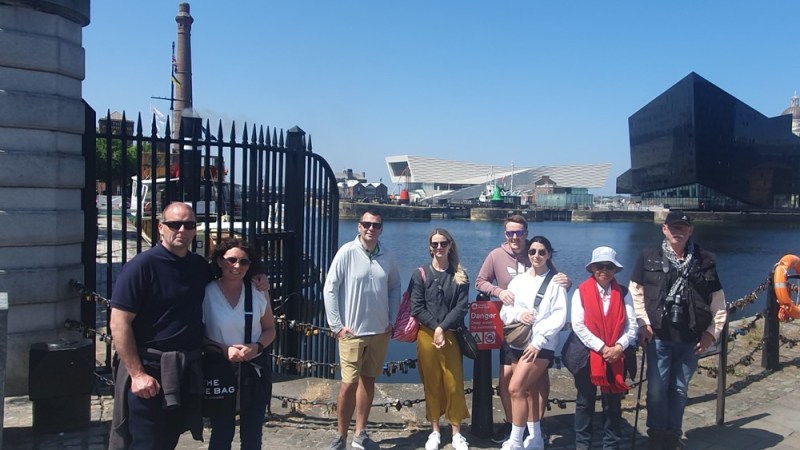 a group of people standing in front of a building