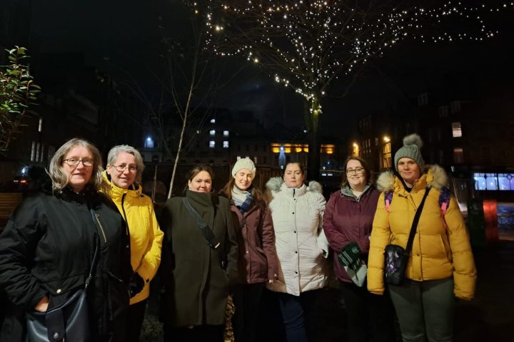 Tony Curtis et al. standing in front of a crowd posing for the camera