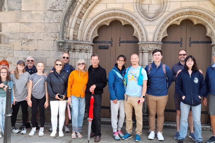 a group of people standing in front of a building