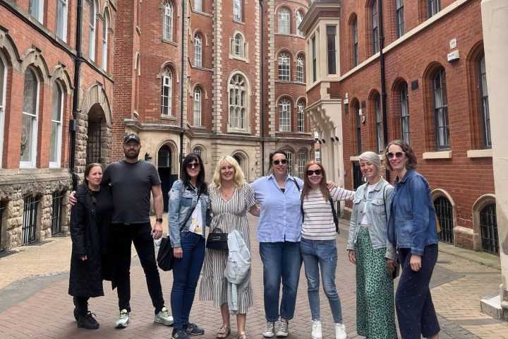 a group of people walking on a city street