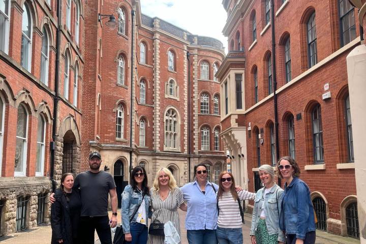 a group of people walking on a city street