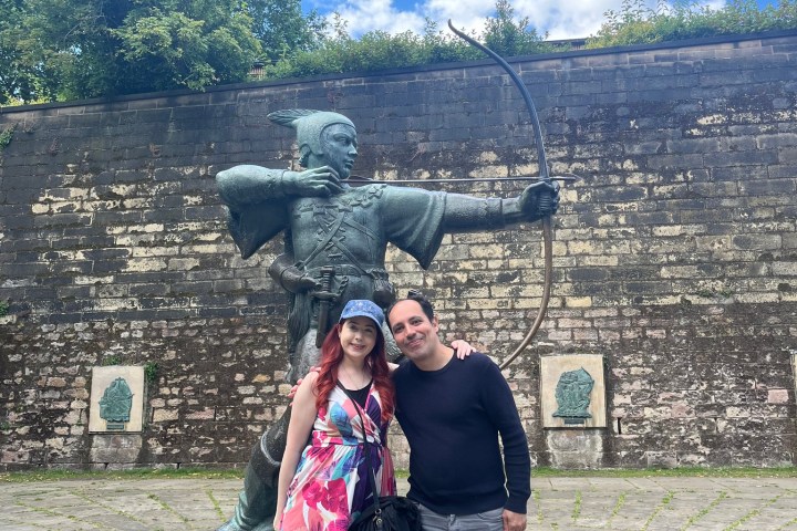 a person standing in front of a statue