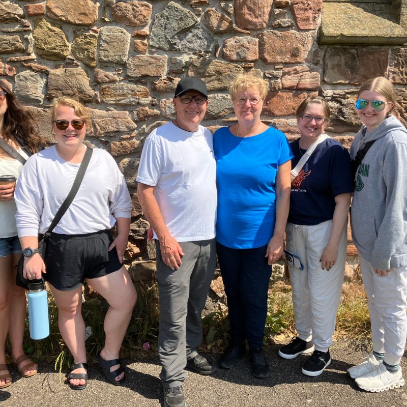 Franziska Troegner et al. standing in front of a crowd posing for the camera