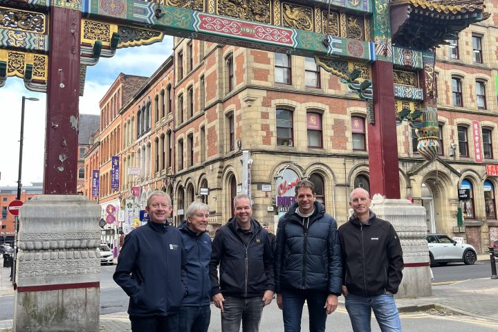 a group of people standing in front of a building