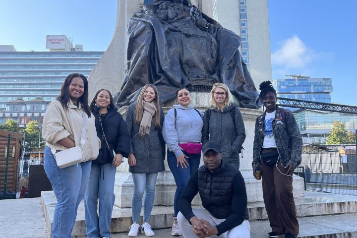a group of people standing in front of a building