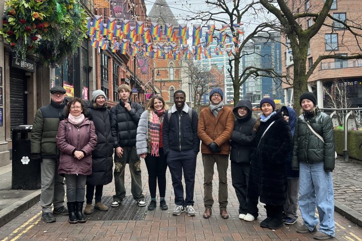 a group of people on a sidewalk