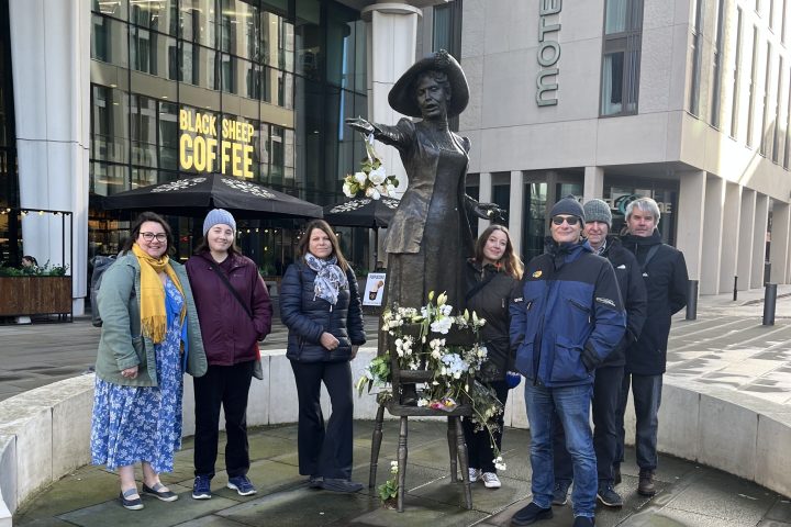 a group of people on a sidewalk