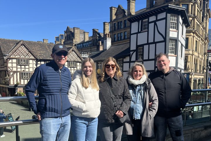 a group of people standing in front of a building
