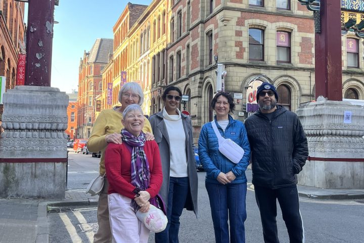 a group of people standing in front of a building