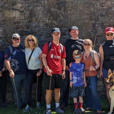 a group of people posing for a picture with a dog
