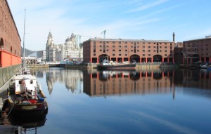 a boat is docked next to a body of water