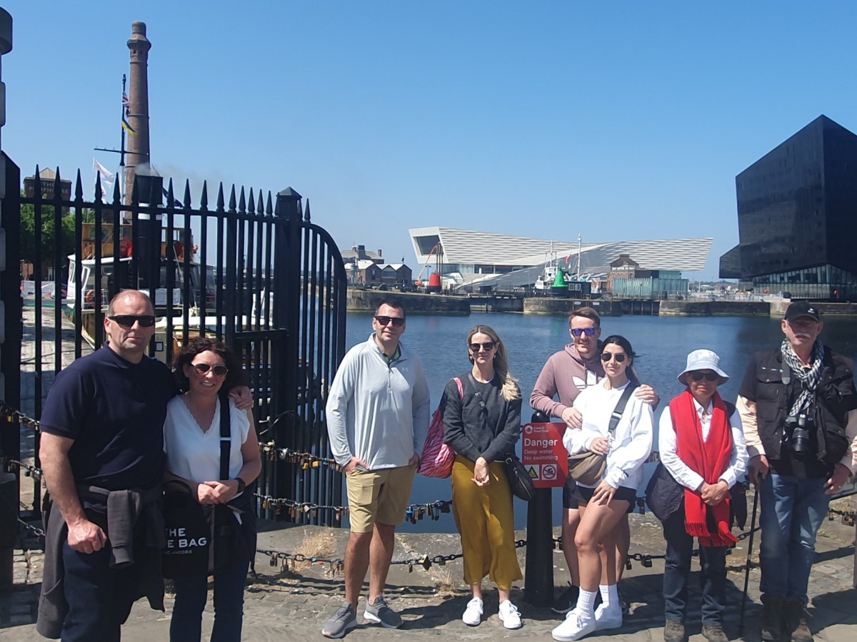 a group of people standing in front of a building