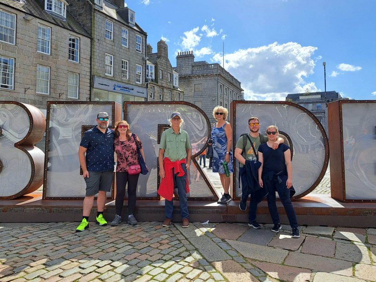 a group of people standing in front of a building