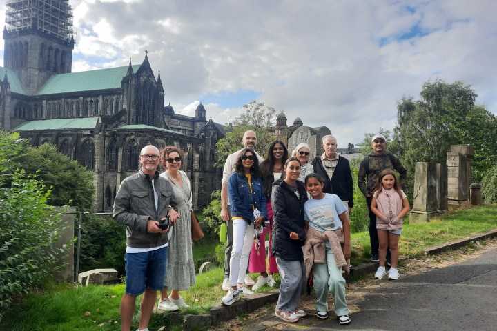 a group of people standing in front of a building