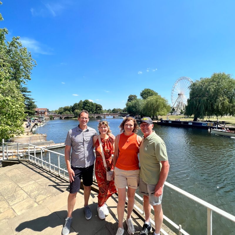 a group of people standing on a bridge