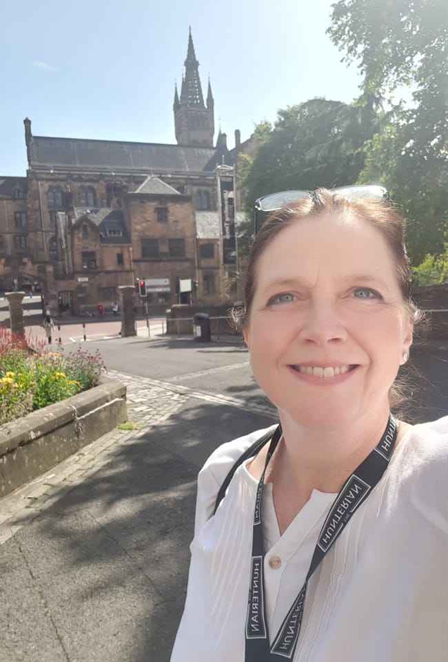 Susan Kramer posing in front of a building