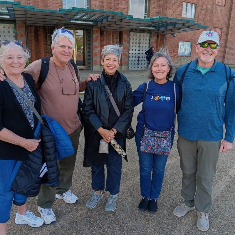 a group of people standing in front of a building