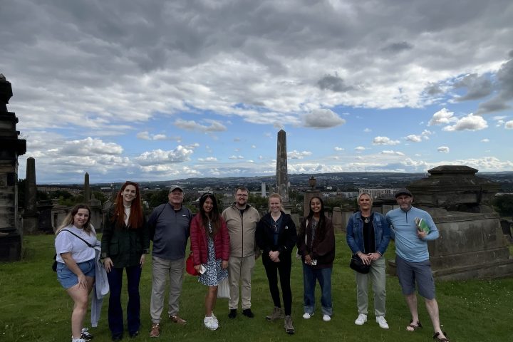 a group of people standing in a field